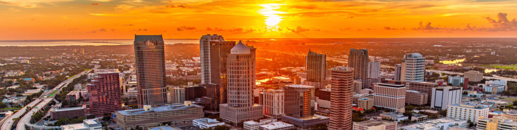Aerial view of beautiful downtown Tampa, Florida at sunset on a warm summer evening shot via helicopter from an altitude of about 500 feet.