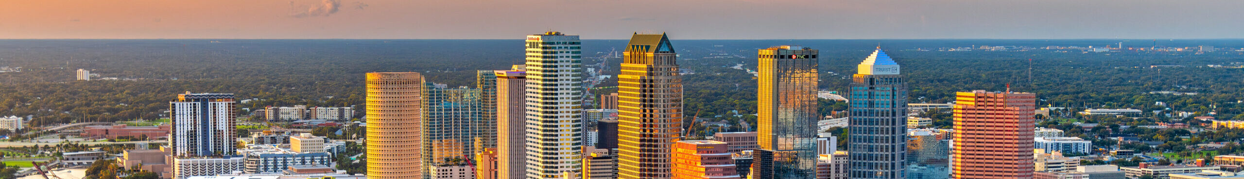 Aerial view of downtown Tampa, Florida along the banks of the Hillsborough River shot via helicopter from an altitude of about 700 feet.